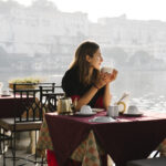 Western woman having a teatime at a cafe in Udaipur